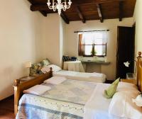 A bed or beds in a room at Relax totale nel Bosco Lucca