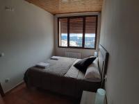 Postel nebo postele na pokoji v ubytování Apartamentos Mirador de Gúdar