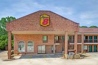 a brick building with a sign on it at Super 8 by Wyndham Marietta&#47;West&#47;Atl Area in Marietta