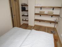 Postel nebo postele na pokoji v ubytování Apartman Honey