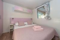 Posteľ alebo postele v izbe v ubytovaní Mobile home Pecten 01