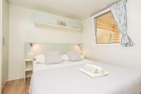 Posteľ alebo postele v izbe v ubytovaní Mobile home Pecten 01