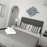 A bed or beds in a room at Nea Stira Studios Kondilia