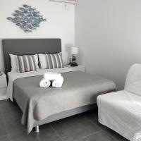 A bed or beds in a room at Nea Stira Studios Kondilia