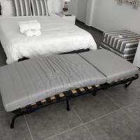 A bed or beds in a room at Nea Stira Studios Kondilia