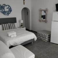 A bed or beds in a room at Nea Stira Studios Kondilia