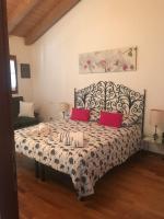 Posteľ alebo postele v izbe v ubytovaní Casa del Balcone Fiorito