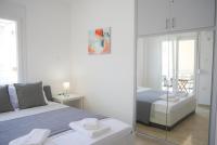 Posteľ alebo postele v izbe v ubytovaní Lux Sea Apartment - Porto Rafti