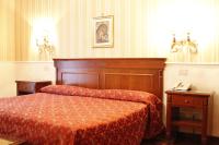 Łóżko lub łóżka w pokoju w obiekcie Hotel Torino