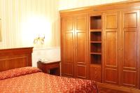 Łóżko lub łóżka w pokoju w obiekcie Hotel Torino