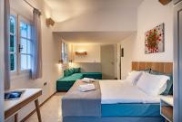 Postel nebo postele na pokoji v ubytování Nefeli Hotel