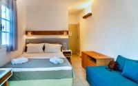 Postel nebo postele na pokoji v ubytování Nefeli Hotel