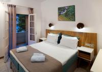 Postel nebo postele na pokoji v ubytování Nefeli Hotel