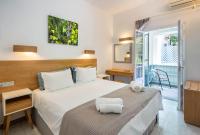 Postel nebo postele na pokoji v ubytování Nefeli Hotel