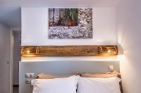 Postel nebo postele na pokoji v ubytování Nefeli Hotel