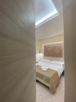 A bed or beds in a room at Vittorio Veneto Accomodation - Tropea city center