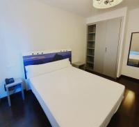 A bed or beds in a room at Calas De Liencres