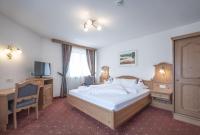 Posteľ alebo postele v izbe v ubytovaní Hotel Garni Schneider