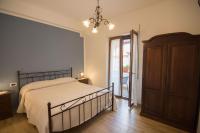 A bed or beds in a room at Relax da Carmen