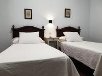 Posteľ alebo postele v izbe v ubytovaní Hostal Cuzco