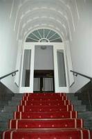 a set of red stairs in a building at Gästehaus Leipzig in Leipzig