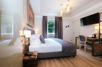 Łóżko lub łóżka w pokoju w obiekcie Lake Hotel La Pieve
