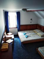 Postel nebo postele na pokoji v ubytování Penzion U Lucerny s malou farmičkou