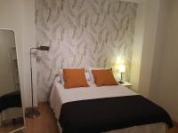 Posteľ alebo postele v izbe v ubytovaní Apartamentos Centro Malaga