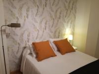 Posteľ alebo postele v izbe v ubytovaní Apartamentos Centro Malaga