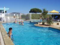 a group of children playing in a swimming pool at Village Club Thalassa in Mèze