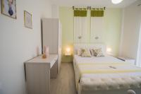 Posteľ alebo postele v izbe v ubytovaní Chelona Apartments