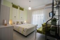 Posteľ alebo postele v izbe v ubytovaní Chelona Apartments