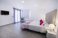 Posteľ alebo postele v izbe v ubytovaní Villas Guzman - Grandiosa