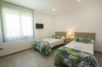 Posteľ alebo postele v izbe v ubytovaní Villas Guzman - Grandiosa