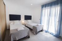 Posteľ alebo postele v izbe v ubytovaní Villas Guzman - Grandiosa