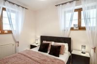 Posteľ alebo postele v izbe v ubytovaní Apartamenty Tatrzańskie Turnie