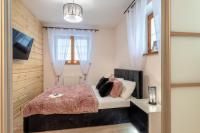 Posteľ alebo postele v izbe v ubytovaní Apartamenty Tatrzańskie Turnie