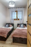 Posteľ alebo postele v izbe v ubytovaní Apartamenty Tatrzańskie Turnie