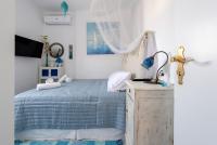Posteľ alebo postele v izbe v ubytovaní Ricos Two Bedroom House - Naoussa Paros