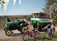 a group of people on bikes and a tractor at Retzerlandhof Familie Graf in Zellerndorf