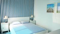 A bed or beds in a room at Apartamento La Manga SPACE
