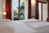Posteľ alebo postele v izbe v ubytovaní Hotel Lido