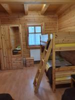 Postel nebo postele na pokoji v ubytování Bak Vendéglő faházak