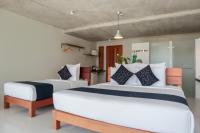 Ein Bett oder Betten in einem Zimmer der Unterkunft Wabi Sabi Boutique Hotel - SHA Extra Plus