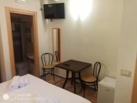 Televízia a/alebo spoločenská miestnosť v ubytovaní B&B L'Antica Dimora ...e dei mestieri
