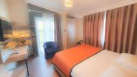 Postel nebo postele na pokoji v ubytování NFK The House Hotel