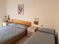 A bed or beds in a room at casa fronte mare