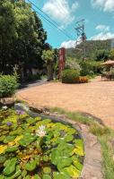 a pond filled with lily pads in a park at Yage Hotspring House in Jiaoxi