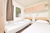 Posteľ alebo postele v izbe v ubytovaní Camping Stella Maris Mobile Homes