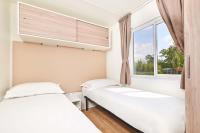 Posteľ alebo postele v izbe v ubytovaní Camping Stella Maris Mobile Homes
